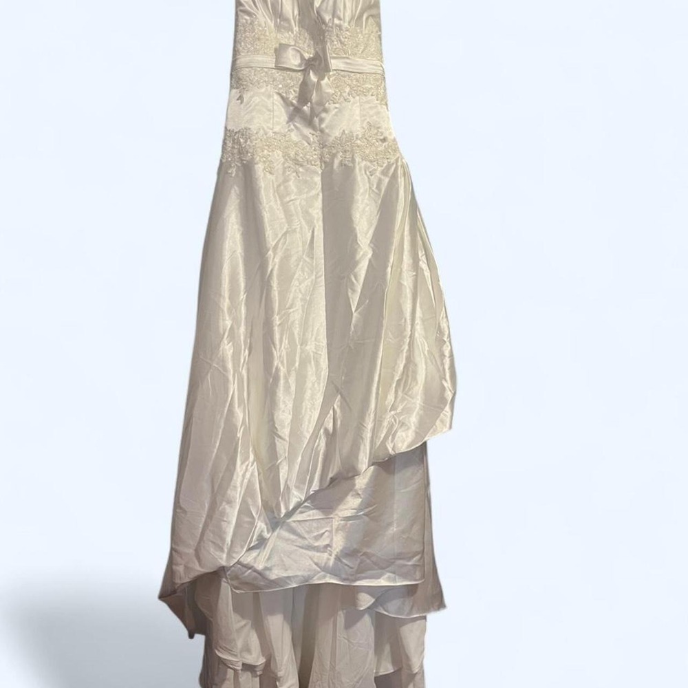 Ivory colored strapless wedding dress with corset back. No tags inside